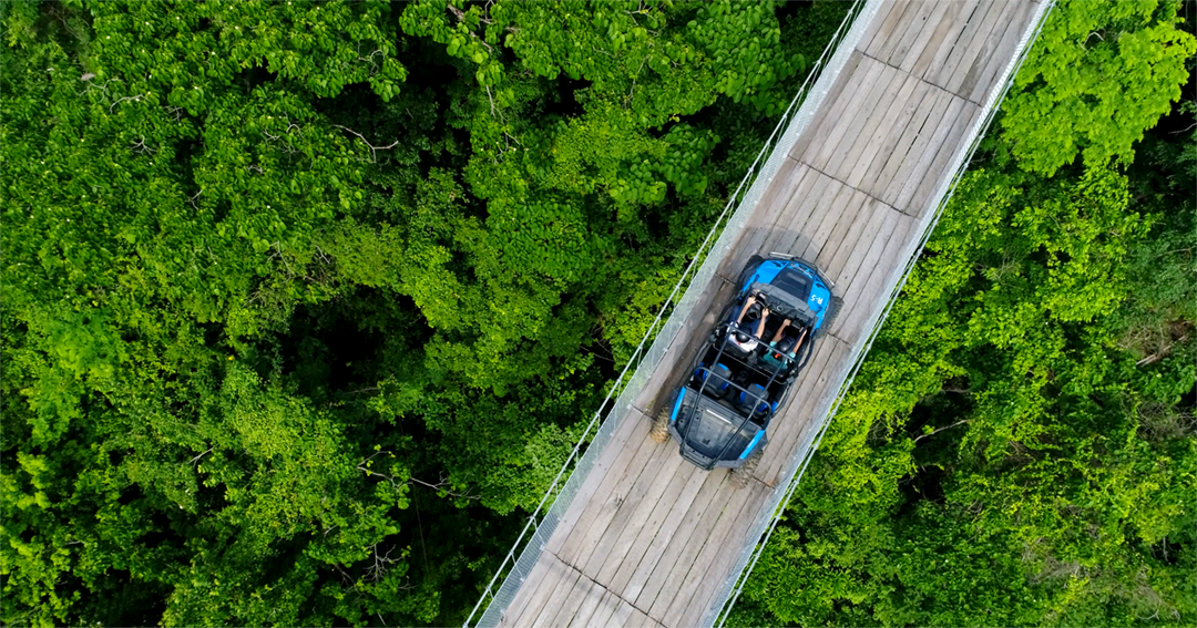 Aerial view of an RZR on the Jorullo Bridge over the Cuale River canyon, Puerto Vallarta